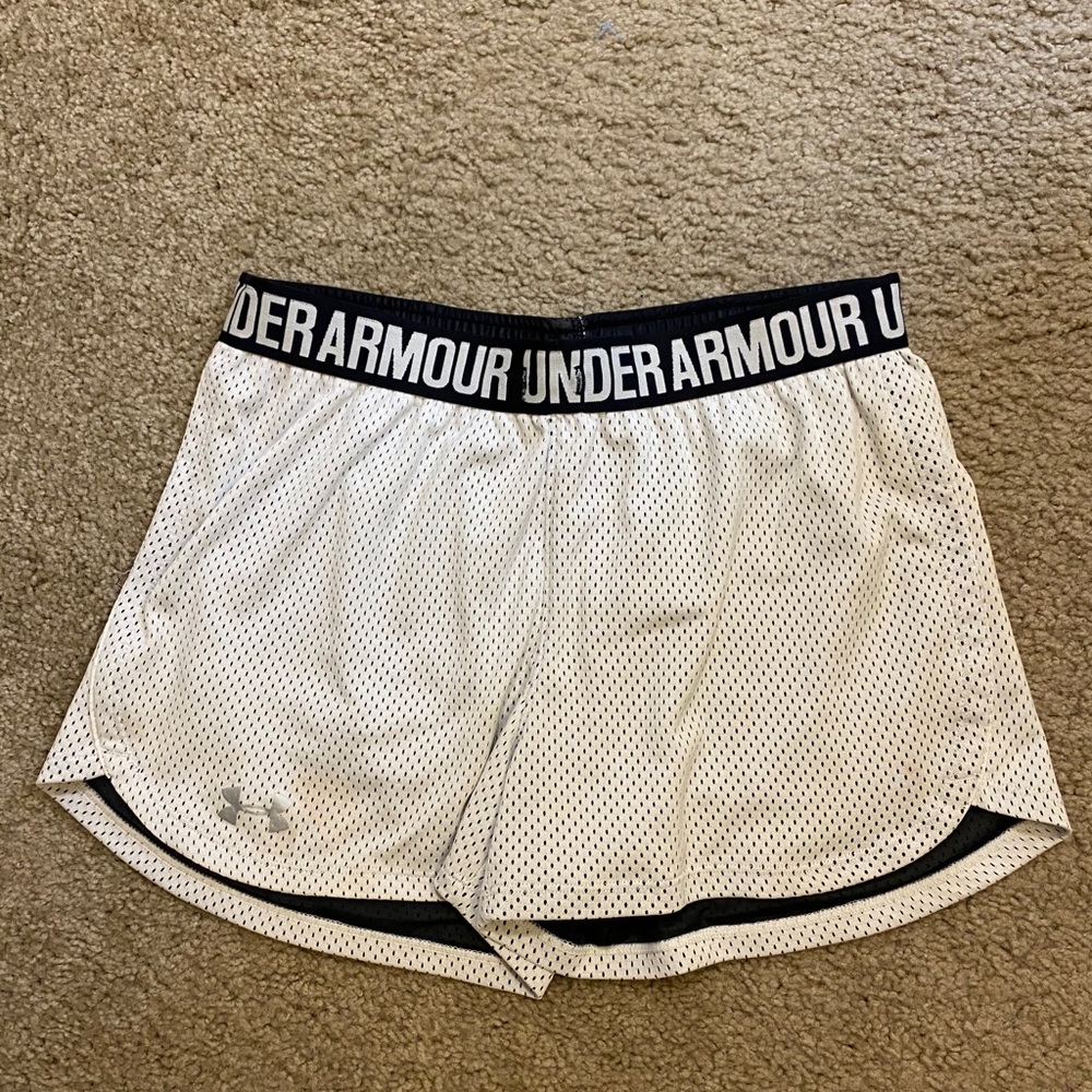 White Under Armour athletic shorts.